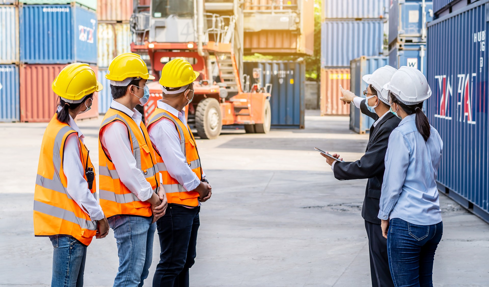 Worker team meeting and training, Logistics and transportation business Containers import concept, The supervisor is meeting with a team of engineers about what to do today